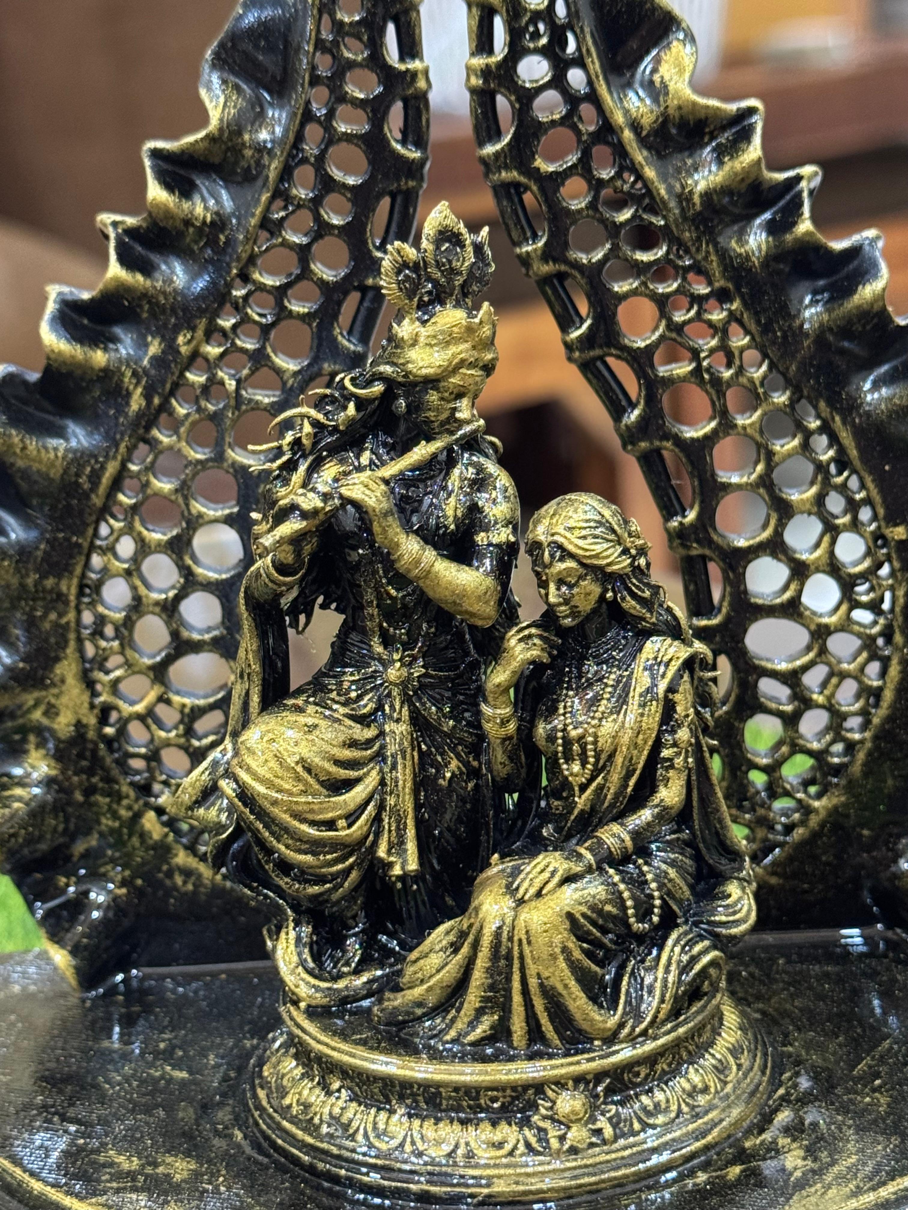 Divine Radha Krishna Idol with Elegant Leaf Arch – Premium Antique Black & Gold Finish Spiritual Home Décor | Jai Shri Radhe Krishna Murti